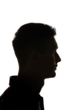Silhouette of man looking away isolated on white